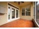 Screened porch with tile flooring and French doors at 13442 Old Dock Rd, Orlando, FL 32828