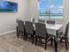 Bright dining area with large table and six chairs at 13615 Ritta Island Dr, Orlando, FL 32827