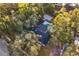 House with a private pool and large backyard, surrounded by lush trees at 1404 N Cove Blvd, Longwood, FL 32750
