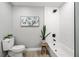 Bathroom with white subway tile and a white toilet at 1404 N Cove Blvd, Longwood, FL 32750