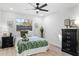 Bedroom with green bedding and ceiling fan at 1404 N Cove Blvd, Longwood, FL 32750