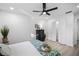 Bedroom with white closet doors and ceiling fan at 1404 N Cove Blvd, Longwood, FL 32750