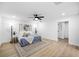 Spacious bedroom with ceiling fan, light flooring and en-suite bathroom at 1404 N Cove Blvd, Longwood, FL 32750