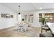 Charming dining area with white table and chairs, and a stylish rug at 1404 N Cove Blvd, Longwood, FL 32750