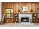 Brick fireplace with wood mantel and built-in shelving at 1404 N Cove Blvd, Longwood, FL 32750