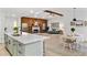 Modern kitchen with white cabinets, a large island, and stainless steel appliances at 1404 N Cove Blvd, Longwood, FL 32750