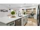 Modern kitchen with island, stainless steel appliances, and white quartz countertops at 1404 N Cove Blvd, Longwood, FL 32750