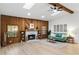 Living room features a wood-burning fireplace and light wood floors at 1404 N Cove Blvd, Longwood, FL 32750