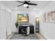 Bright home office with a desk, chair, and ample natural light at 1404 N Cove Blvd, Longwood, FL 32750