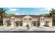 Three-unit townhome building with attached garages and landscaping at 1517 Isleta Loop, Kissimmee, FL 34741