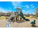 Community playground with playset, swings, and benches at 1517 Isleta Loop, Kissimmee, FL 34741