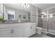 Bathroom with a double vanity and shower at 1564 Flange Dr, Davenport, FL 33896