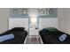 Guest bedroom with twin beds and nightstands, ideal for sharing at 1564 Flange Dr, Davenport, FL 33896
