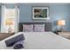 Bedroom with a queen bed and nightstands at 1564 Flange Dr, Davenport, FL 33896