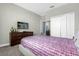 Bedroom with a queen bed and dresser at 1564 Flange Dr, Davenport, FL 33896