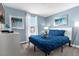 Spacious bedroom with a queen bed, ample natural light, and tasteful artwork at 1564 Flange Dr, Davenport, FL 33896