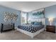 Bedroom with king-size bed and stylish decor at 1564 Flange Dr, Davenport, FL 33896