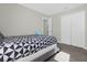 Bedroom with a queen-size bed and white closet doors at 1564 Flange Dr, Davenport, FL 33896
