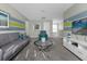 Spacious common area with comfortable seating and a large TV at 1564 Flange Dr, Davenport, FL 33896