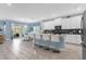 Open concept kitchen with island and stainless steel appliances at 1564 Flange Dr, Davenport, FL 33896