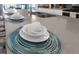 Kitchen island with cups and plates on a placemat at 1564 Flange Dr, Davenport, FL 33896