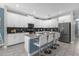 Modern kitchen with white cabinets and granite countertops at 1564 Flange Dr, Davenport, FL 33896