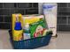 Blue basket with dish soap, sponges and paper towels at 1564 Flange Dr, Davenport, FL 33896
