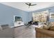 Spacious living room with tile floors, comfy seating, and large TV at 1564 Flange Dr, Davenport, FL 33896