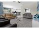 Open floor plan living room with kitchen view and seating at 1564 Flange Dr, Davenport, FL 33896