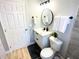 Modern bathroom with white vanity and black accents at 1632 Gar St, St Cloud, FL 34771