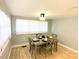 Charming dining room with light gray walls and wood flooring at 1632 Gar St, St Cloud, FL 34771