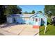 Cute blue house with a large yard, driveway and garage at 1632 Gar St, St Cloud, FL 34771