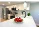 Updated kitchen with white cabinets and quartz countertops at 1632 Gar St, St Cloud, FL 34771