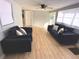Living room with hardwood floors and comfy sofas at 1632 Gar St, St Cloud, FL 34771