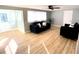 Living room with hardwood floors and comfy sofas at 1632 Gar St, St Cloud, FL 34771