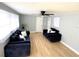 Living room with hardwood floors and comfy sofas at 1632 Gar St, St Cloud, FL 34771