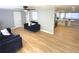Bright living room with comfy sofas and wood-look floors at 1632 Gar St, St Cloud, FL 34771