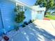 Landscaped side yard with gravel and plants at 1632 Gar St, St Cloud, FL 34771