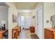 Bright and airy entryway with a wooden console table at 1677 Slash Pine Pl, Oviedo, FL 32765