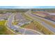 Aerial view of house and surrounding neighborhood at 1987 Key Bay Trl, Kissimmee, FL 34747
