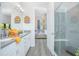Bathroom boasts double sinks, a walk-in shower, and views into the bedroom at 1987 Key Bay Trl, Kissimmee, FL 34747