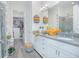 Modern bathroom with double vanity, walk-in shower, and large closet at 1987 Key Bay Trl, Kissimmee, FL 34747