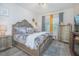 Elegant main bedroom with a king-size bed and plenty of closet space at 1987 Key Bay Trl, Kissimmee, FL 34747