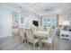 Open dining room with view of the living room and kitchen at 1987 Key Bay Trl, Kissimmee, FL 34747