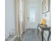 Bright entryway with neutral tones, hardwood floors, and a console table at 1987 Key Bay Trl, Kissimmee, FL 34747