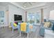 Spacious living area featuring a large TV, comfortable seating and plenty of natural light at 1987 Key Bay Trl, Kissimmee, FL 34747