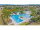 Community pool with multiple lap lanes and lounging areas at 1987 Key Bay Trl, Kissimmee, FL 34747