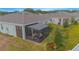 Screened porch with seating area, providing relaxing outdoor space at 1987 Key Bay Trl, Kissimmee, FL 34747