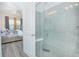 Walk-in shower with a built-in seat and modern tile at 1987 Key Bay Trl, Kissimmee, FL 34747