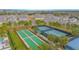 Aerial view of the tennis and bocce ball courts with well maintained landscape at 1987 Key Bay Trl, Kissimmee, FL 34747